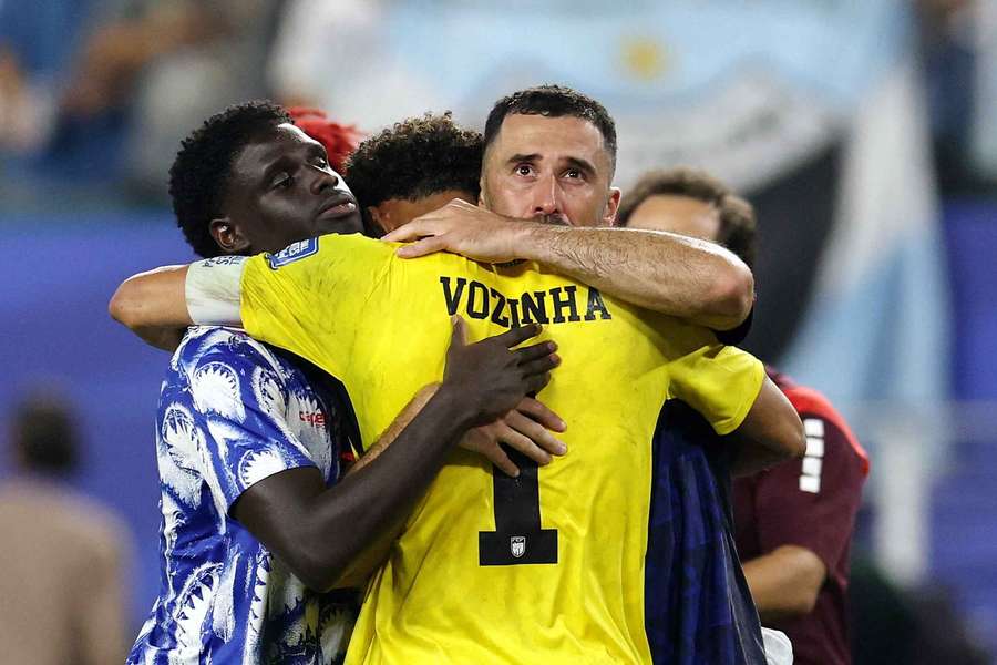 Cape Verde's Vozinha (centre) reacts with teammates after the match Cape Verde's Vozinha (centre) reacts with teammates after the match