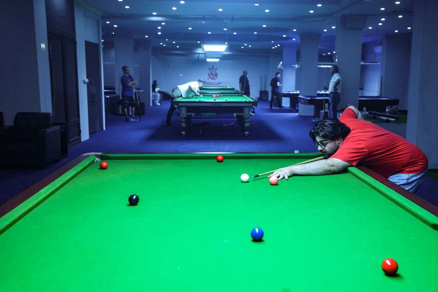 A man plays snooker at a club in Tehran on June 26, 2023