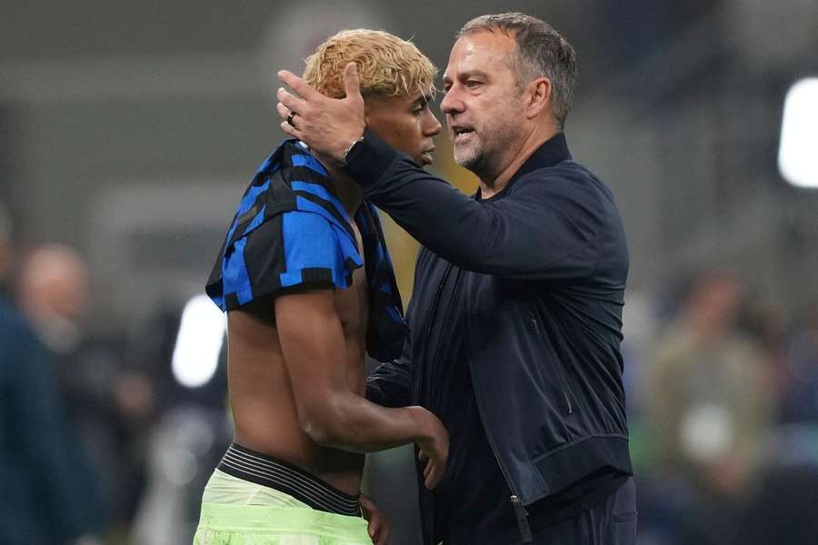 Barcelona's head coach Hansi Flick comforts Lamine Yamal after the Champions League semifinal second leg against Inter Milan on May 6, 2025