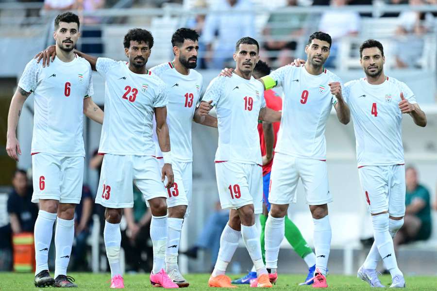 Iran players celebrate goal in friendly against Gambia