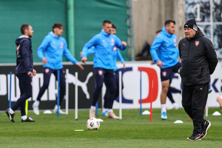 Miroslav Koubek looks on as his players train Miroslav Koubek looks on as his players train