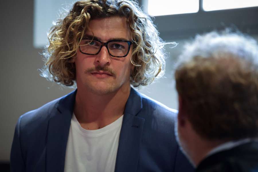 French rugby player Bastien Chalureau looks on as he arrives to appear on appeal at the courthouse in Toulouse