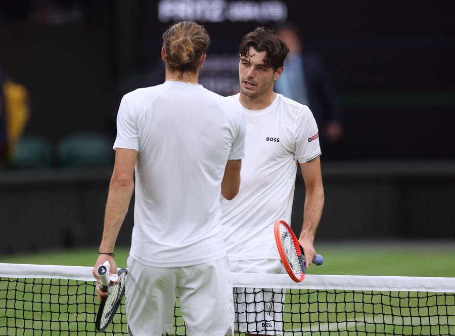 Taylor Fritz shakes hands with Alexander Zverev after winning their match