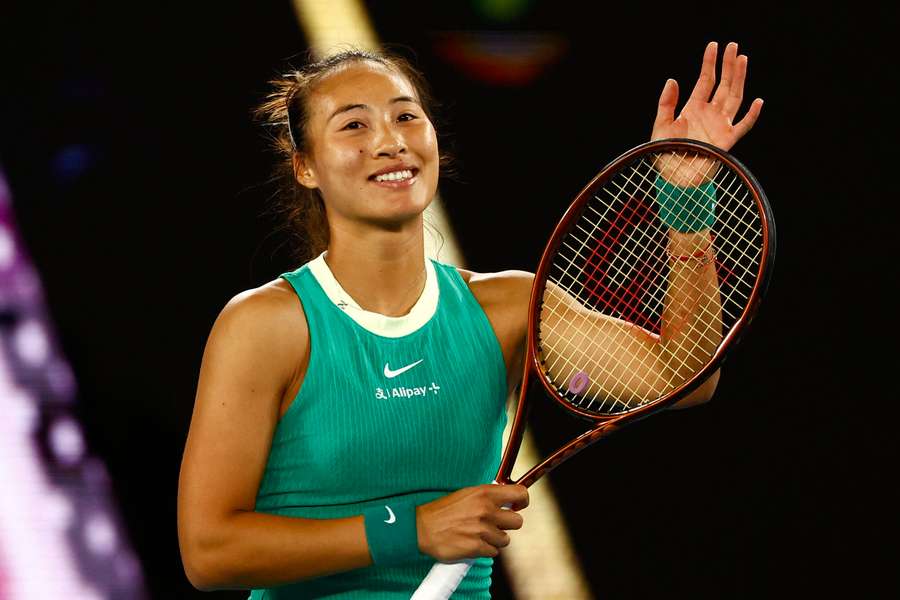 Qinwen Zheng salutes the crowd after her win