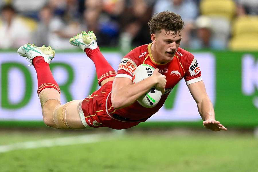 Dolphins' Jack Bostock dives over the line to record one of his four tries at the weekend.