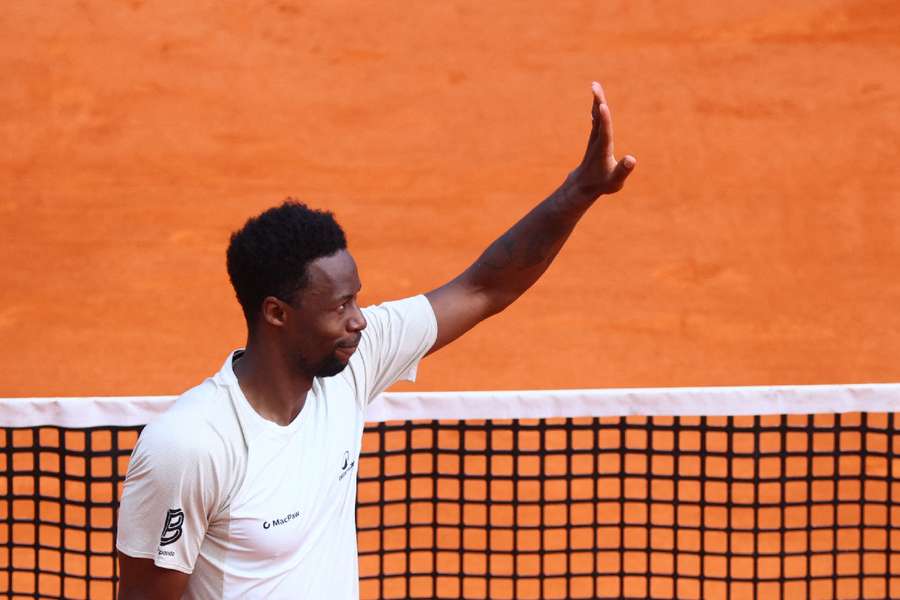 Gael Monfils gestures to the crowd after losing against Alexander Bublik 