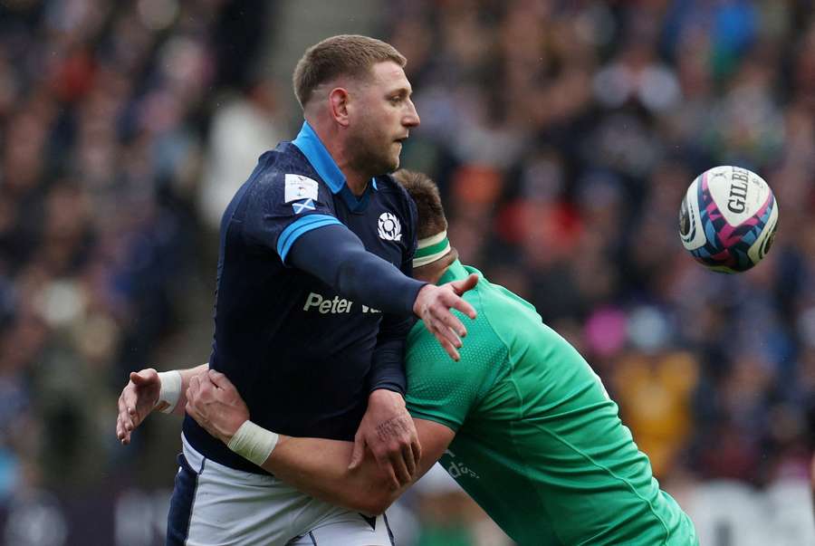 Russell in action with Scotland
