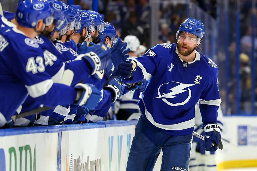 Victor Hedman of the Tampa Bay Lightning skates by the team bench and celebrates his goal against the Toronto Maple Leafs