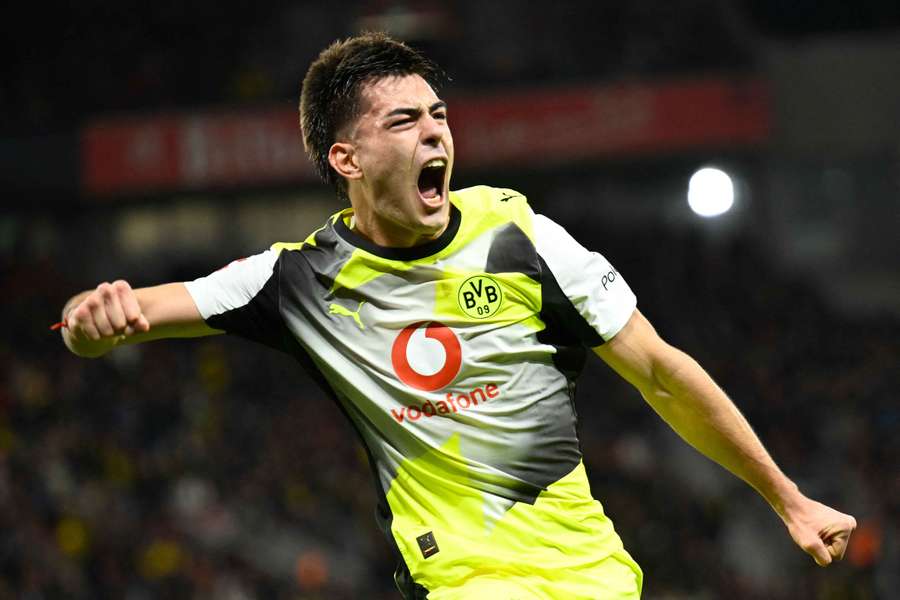 Dortmund's Argentinian defender Aaron Anselmino celebrates scoring against Bayer Leverkusen Dortmund's Argentinian defender Aaron Anselmino celebrates scoring against Bayer Leverkusen