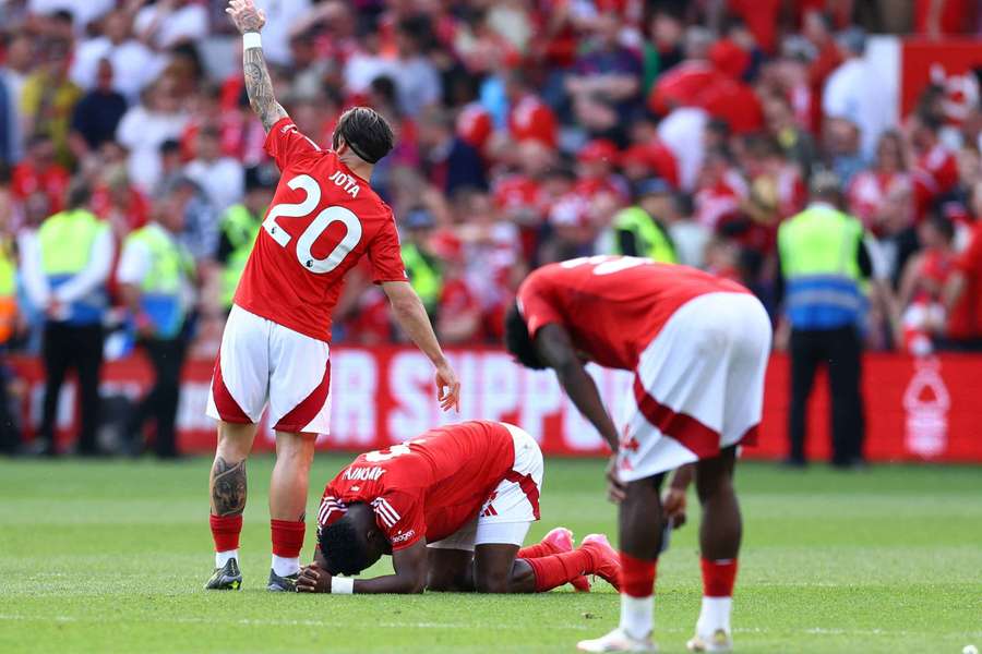 Taiwo Awoniyi goes down injured after the collision