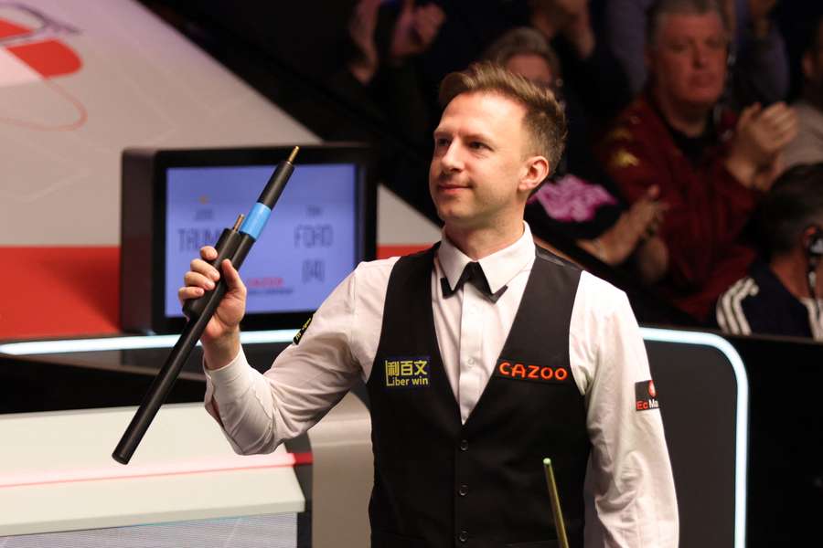 Judd Trump celebrates his victory against Tom Ford
