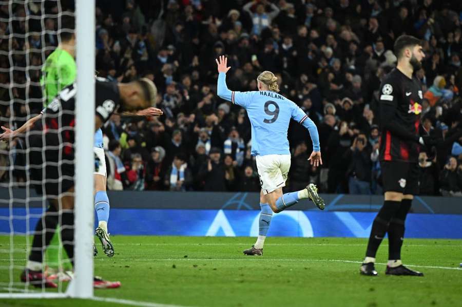 Erling Haaland runs away in celebration after netting his fifth goal of the evening