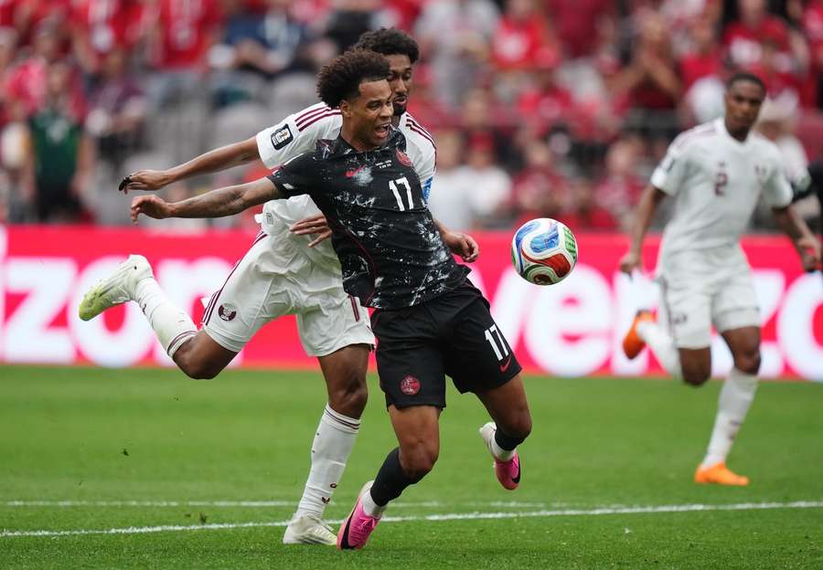 Canada's Tajon Buchanan is fouled by Qatar's Homam Ahmed Canada's Tajon Buchanan is fouled by Qatar's Homam Ahmed