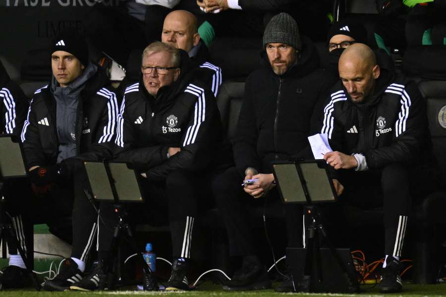 Dutch manager Erik ten Hag (2R) looks on during the English FA Cup third round football match between Wigan Athletic and Manchester United