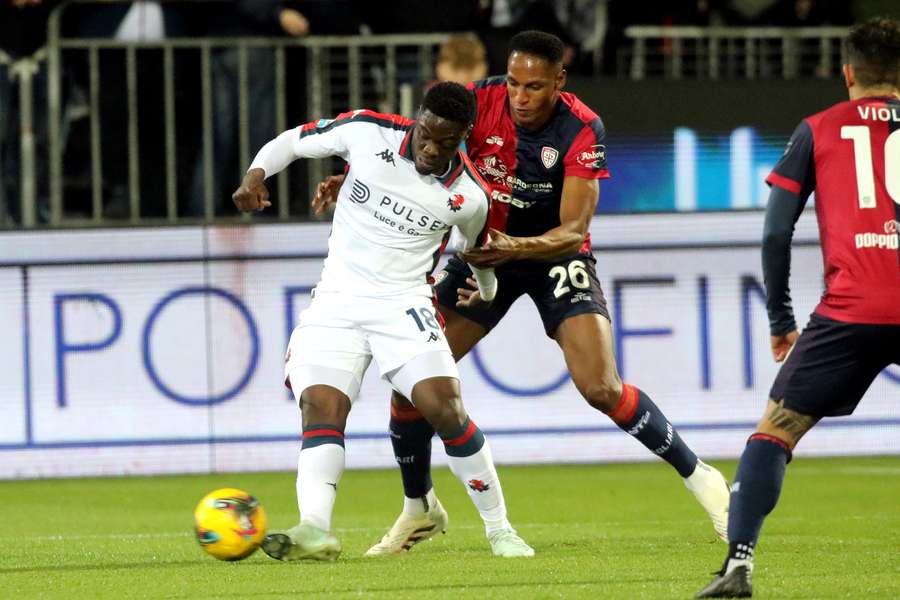 Yerry Mina of Cagliari and Caleb Ekuban of Genoa battle for the ball