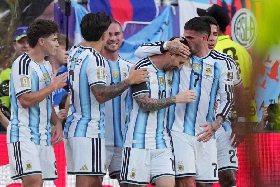 Argentina players celebrate a goal against Switzerland