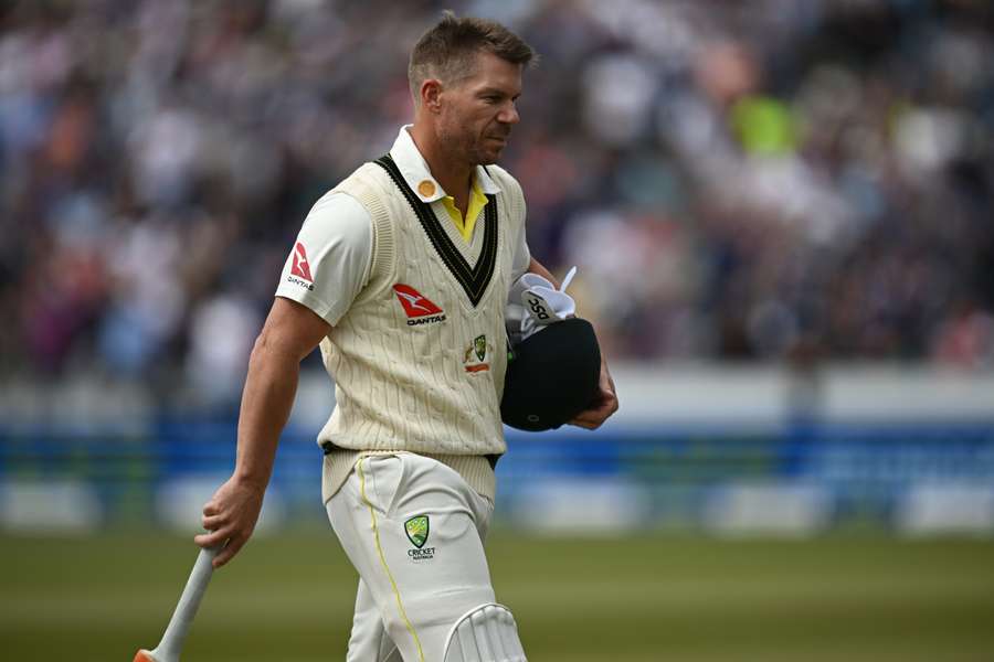 Australia's David Warner reacts as he walks back to the pavilion after losing his wicket