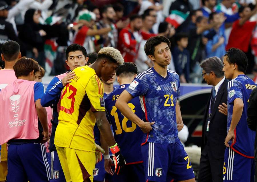 Japan's players look dejected after the match