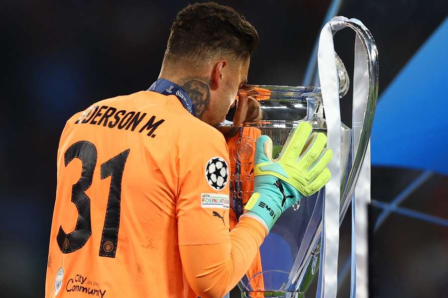 Ederson kisses the Champions League trophy after making some important saves in the final