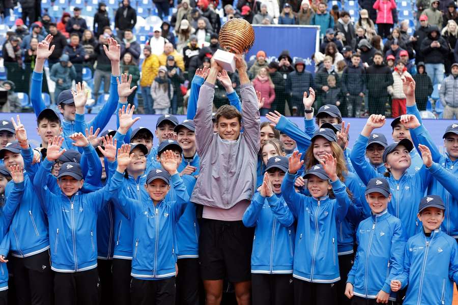 Flavio Cobolli celebrates with the trophy after defeating Sebastian Baez in the final match of ATP 250 Tiriac Open Flavio Cobolli celebrates with the trophy after defeating Sebastian Baez in the final match of ATP 250 Tiriac Open