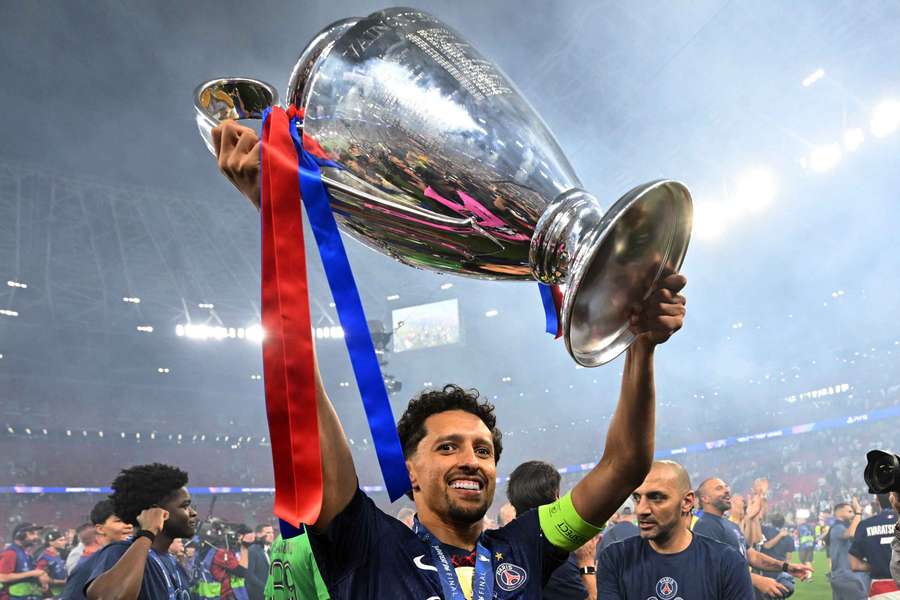 PSG's Marquinhos celebrates with the trophy after winning the UEFA Champions League in 2026 PSG's Marquinhos celebrates with the trophy after winning the UEFA Champions League in 2026