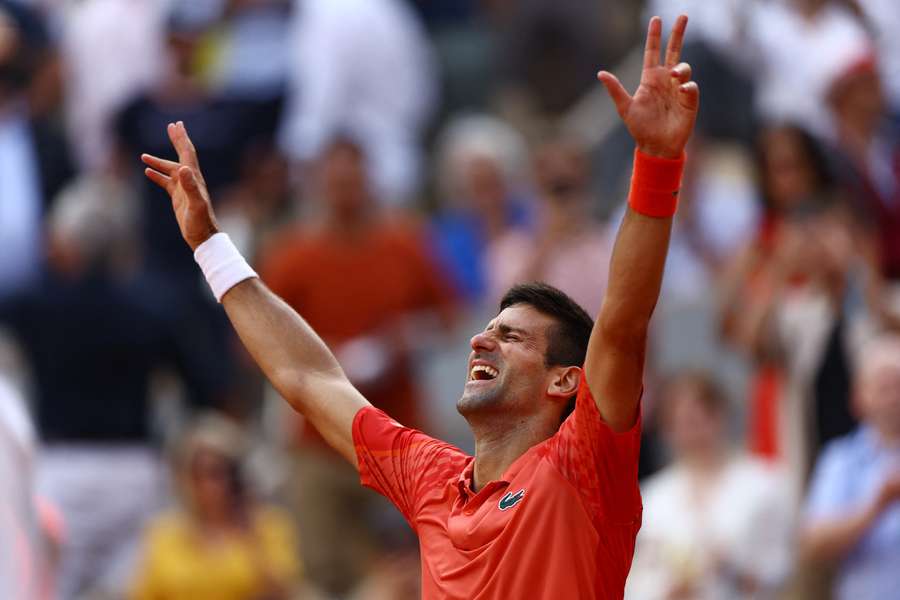 Novak Djokovic celebrates winning the French Open over Casper Ruud