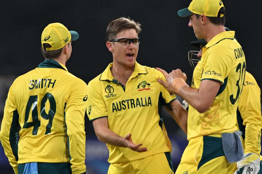 Australia's Adam Zampa celebrates with teammates after taking the wicket of Sri Lanka's Chamika Karunaratne