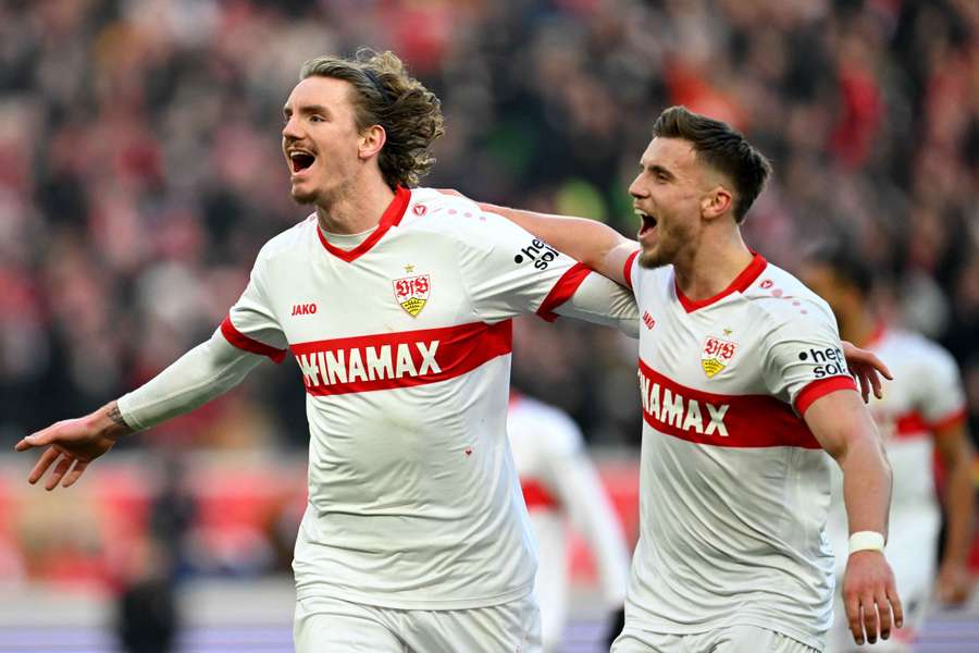 Nick Woltemade (left) of Stuttgart celebrates scoring his team's third goal