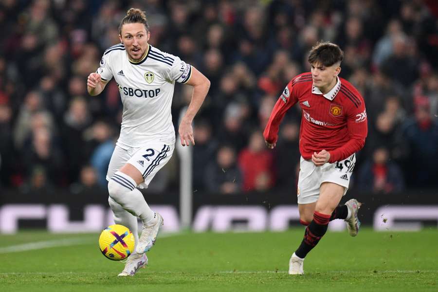 Luke Ayling fights for the ball with Alejandro Garnacho during the Premier League match between Manchester United and Leeds