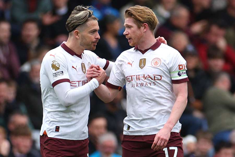 Kevin De Bruyne of Manchester City celebrates scoring his team's first goal with teammate Jack Grealish