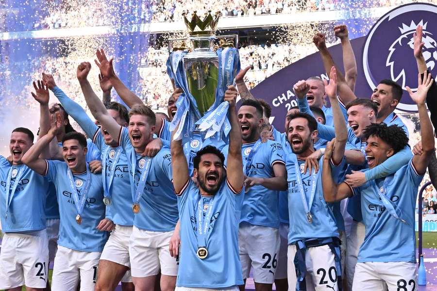 Ilkay Gundogan lifts the Premier League trophy