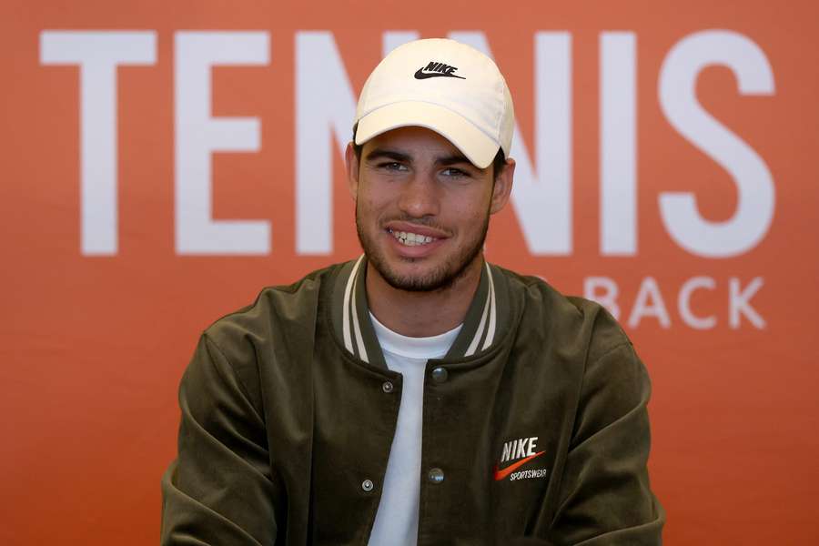 Carlos Alcaraz of Spain fields questions from the media during the Miami Open 