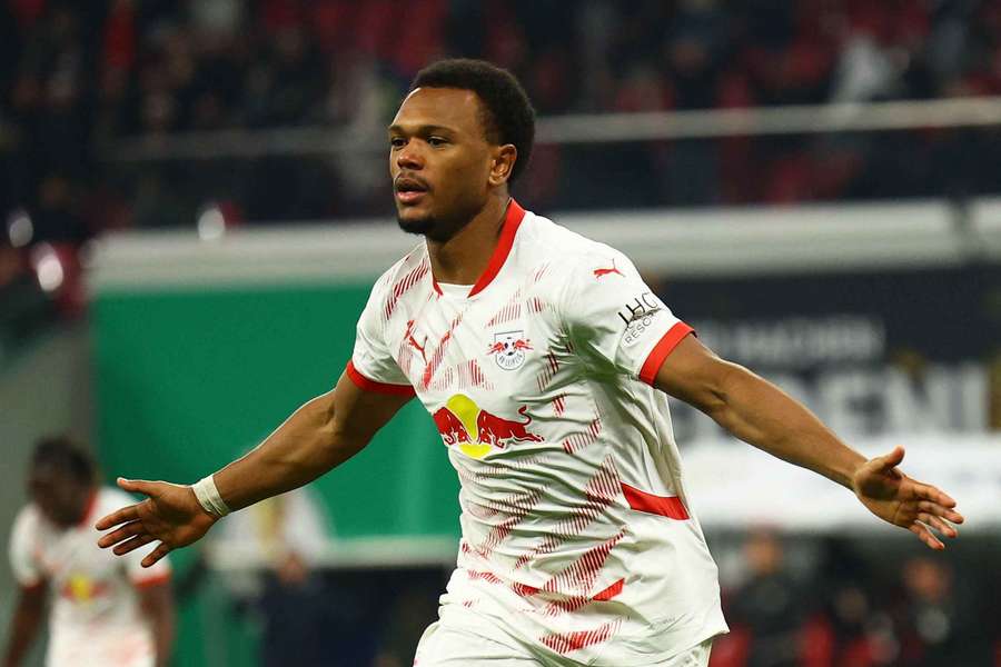 RB Leipzig's Lois Openda celebrates scoring their second goal against Eintracht Frankfurt