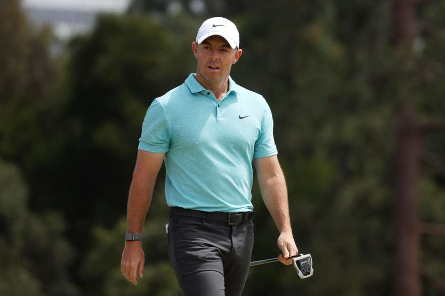 Rory McIlroy of Northern Ireland reacts after missing an eagle putt attempt