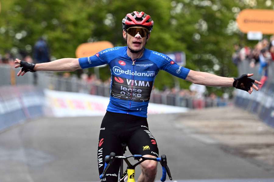 Jonas Vingegaard celebrates after winning stage nine