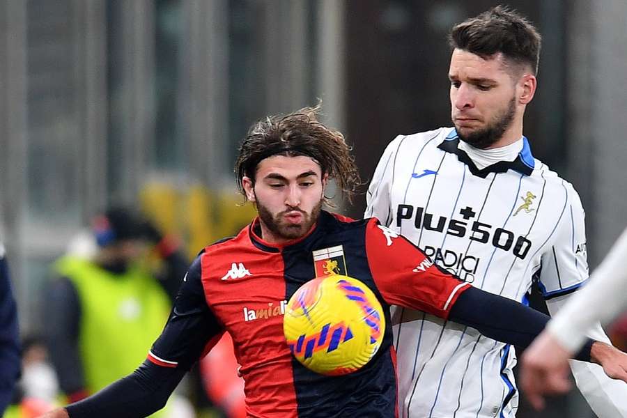 Genoa's Manolo Portanova in action with Atalanta's Berat Djimsiti