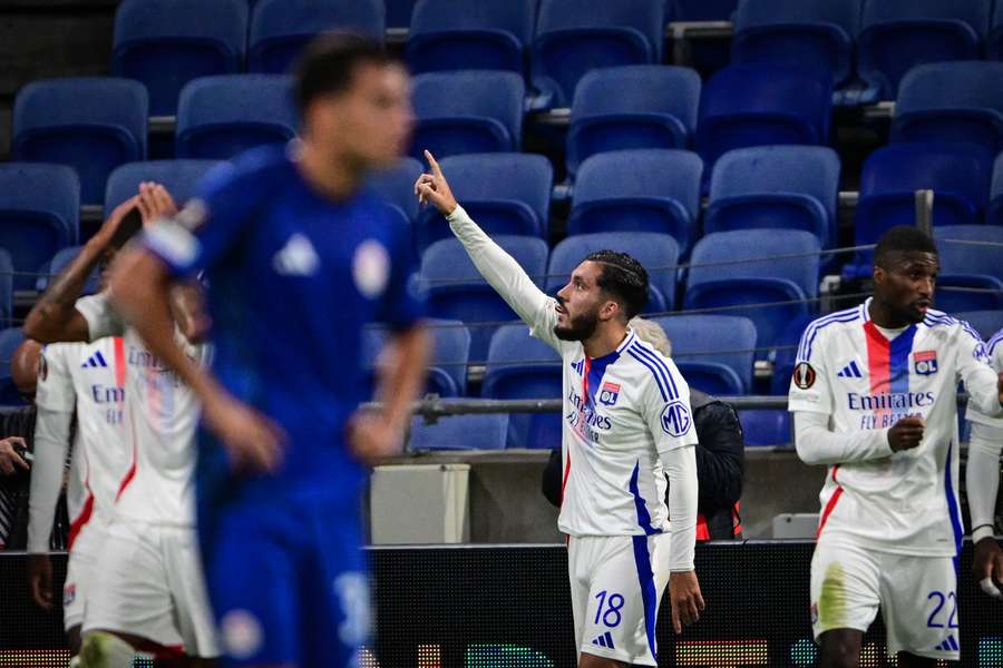 Lyon's French midfielder #18 Ryan Cherki (C) celebrates scoring his team's first goal 