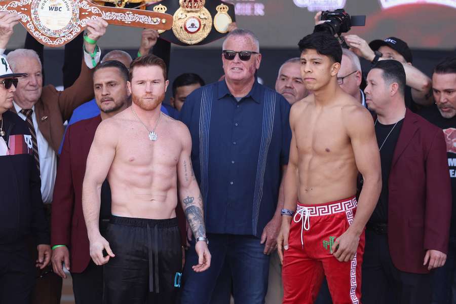 Undisputed super middleweight champion Canelo Alvarez (L) and Jaime Munguia pose during their official weigh-in