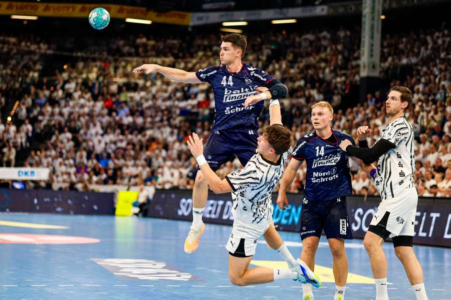 Flensburg's Aymeric Minne (left) and Kiel's Rasmus Ankermann battle for the ball Flensburg's Aymeric Minne (left) and Kiel's Rasmus Ankermann battle for the ball