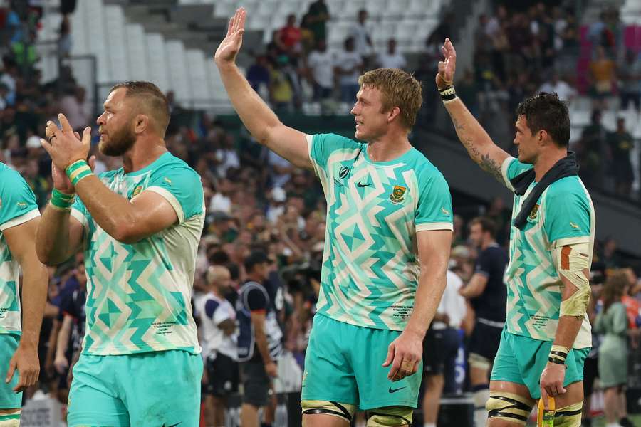 South Africa's players celebrate after their opening win