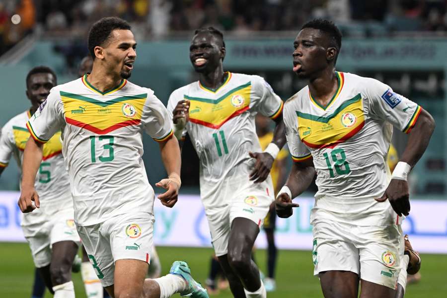 Senegalese forwards Iliman Ndiaye (L) and Ismaila Sarr celebrate against Ecuador