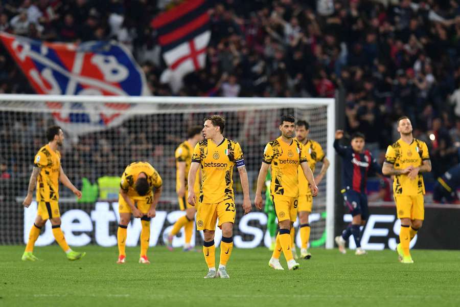 Inter Milan players look dejected after conceding late against Bologna on Sunday