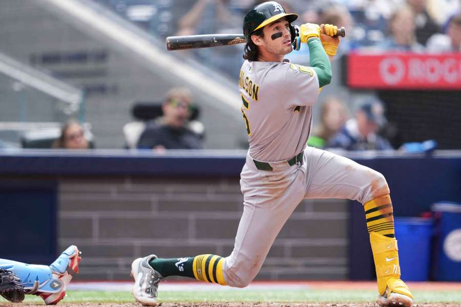 Athletics' Jacob Wilson hits a sac-fly against the Toronto Blue Jays