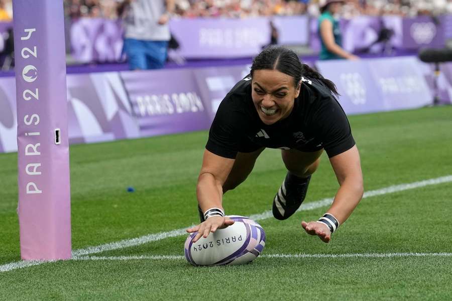 New Zealand's Stacey Waaka dives over the line to score a try during the women's gold medal match 