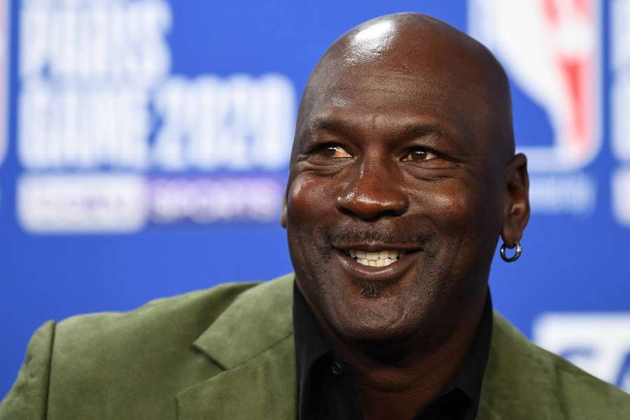Michael Jordan, former NBA star and owner of Charlotte Hornets, looks on as he addresses a press conference
