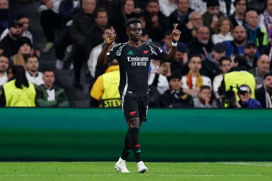 Bukayo Saka celebrates his goal as Arsenal knock out Real Madrid in the UEFA Champions League.