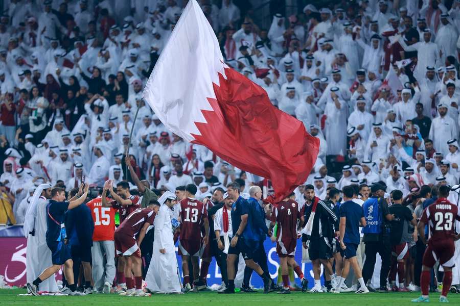 Qatar celebrate their qualification