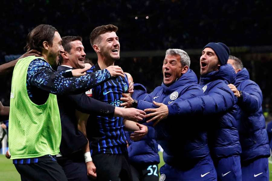 Inter's Petar Sucic celebrates scoring their third goal with teammates