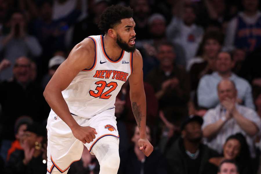 New York Knicks' Karl Anthony-Towns celebrating after an emphatic dunk 
