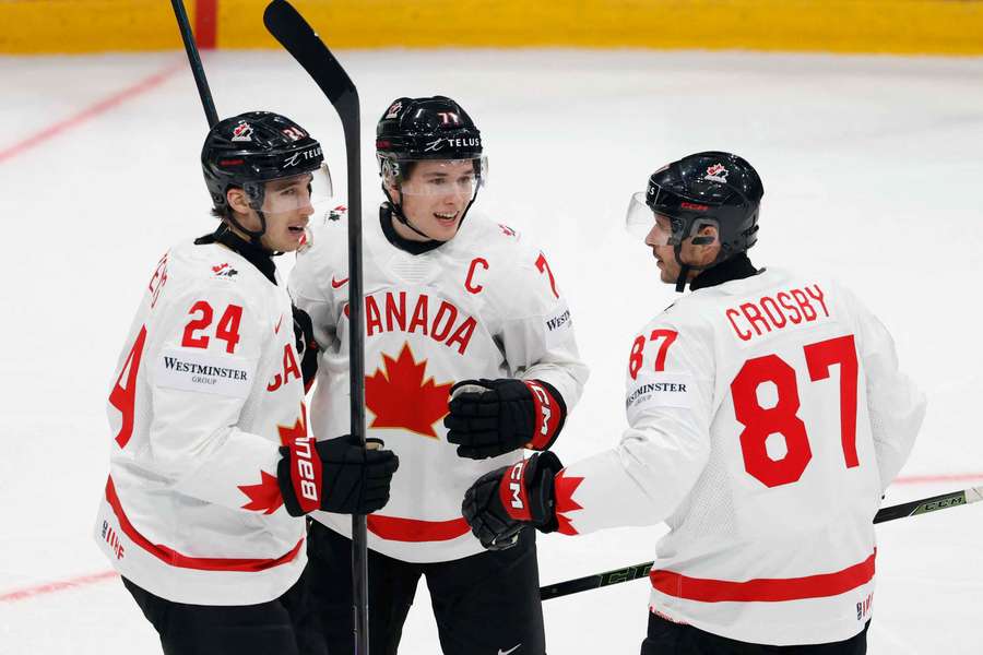 Canada's Sidney Crosby talks with Dylan Cozens and Macklin Celebrini Canada's Sidney Crosby talks with Dylan Cozens and Macklin Celebrini